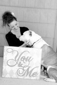 pit bull with cute girl holding a sign saying "you and me"