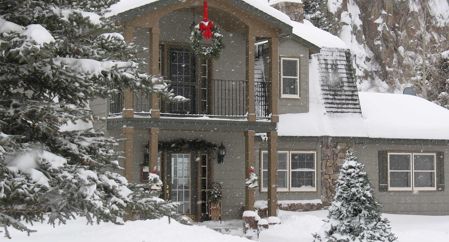 Picture of the home with snow.